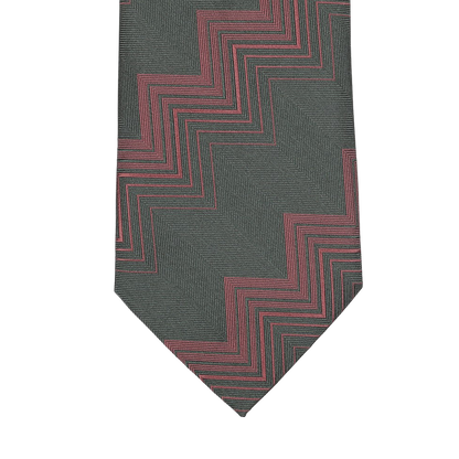 Close-up of a Seaward & Stearn handmade silk tie featuring a herringbone zigzag pattern in dark green tones.