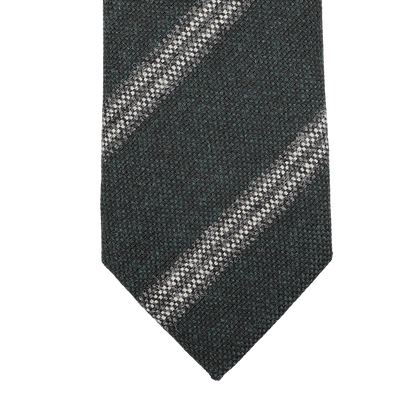 The Dark Green Striped Wool Tie by Seaward & Stearn is handmade in England and exudes quality and style with its dark green textured appearance and a diagonal light-colored stripe.