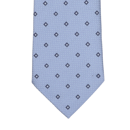 A light blue silk tie from Seaward & Stearn, featuring a pattern of small navy square dots arranged in a grid, expertly handmade in England.
