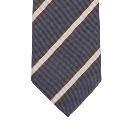 Close-up of the Navy Blue Brown Striped Silk Tie by Seaward & Stearn, handmade in England, featuring diagonal stripes in white and brown.