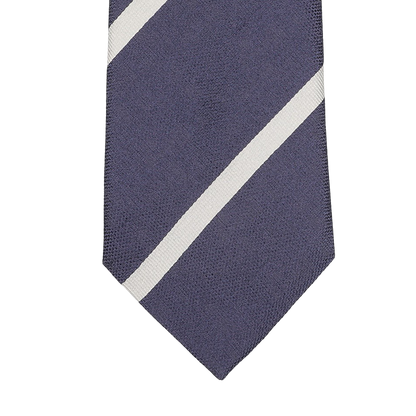 Close-up of the Seaward & Stearn Navy Blue Cream Striped Silk Tie, meticulously handmade in England from luxurious silk, featuring two diagonal white stripes.