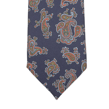 Introducing the Navy Blue Paisley Printed Silk Tie by Seaward & Stearn, a finely handcrafted accessory made in England that features a stunning pattern of navy blue intertwining with vibrant red, blue, and green hues.