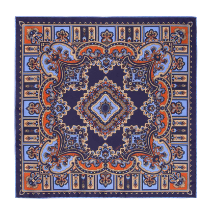 Introducing the Licorice Barolo Silk Pocket Square by Sera Fine Silk, featuring an intricate symmetrical pattern in shades of blue, orange, and beige on a navy background. This exquisite design incorporates both floral and geometric elements, crafted from Pure Como silk with meticulously hand-rolled edges.