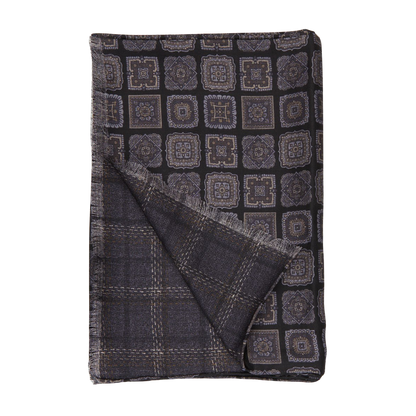 A Black Geometric Wool Silk Double Sided Scarf designed by Silvio Fiorello, on a white background.