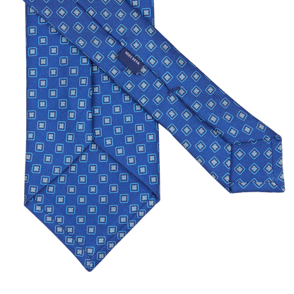 A Blue Geometric Printed Silk Tie by Silvio Fiorello.