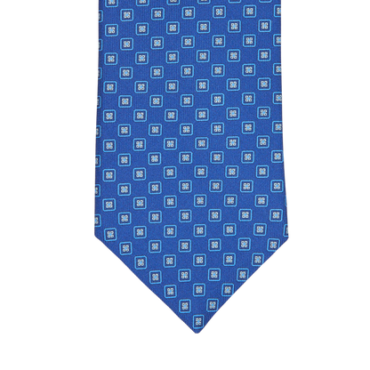 A Blue Geometric Printed Silk Tie by Silvio Fiorello.