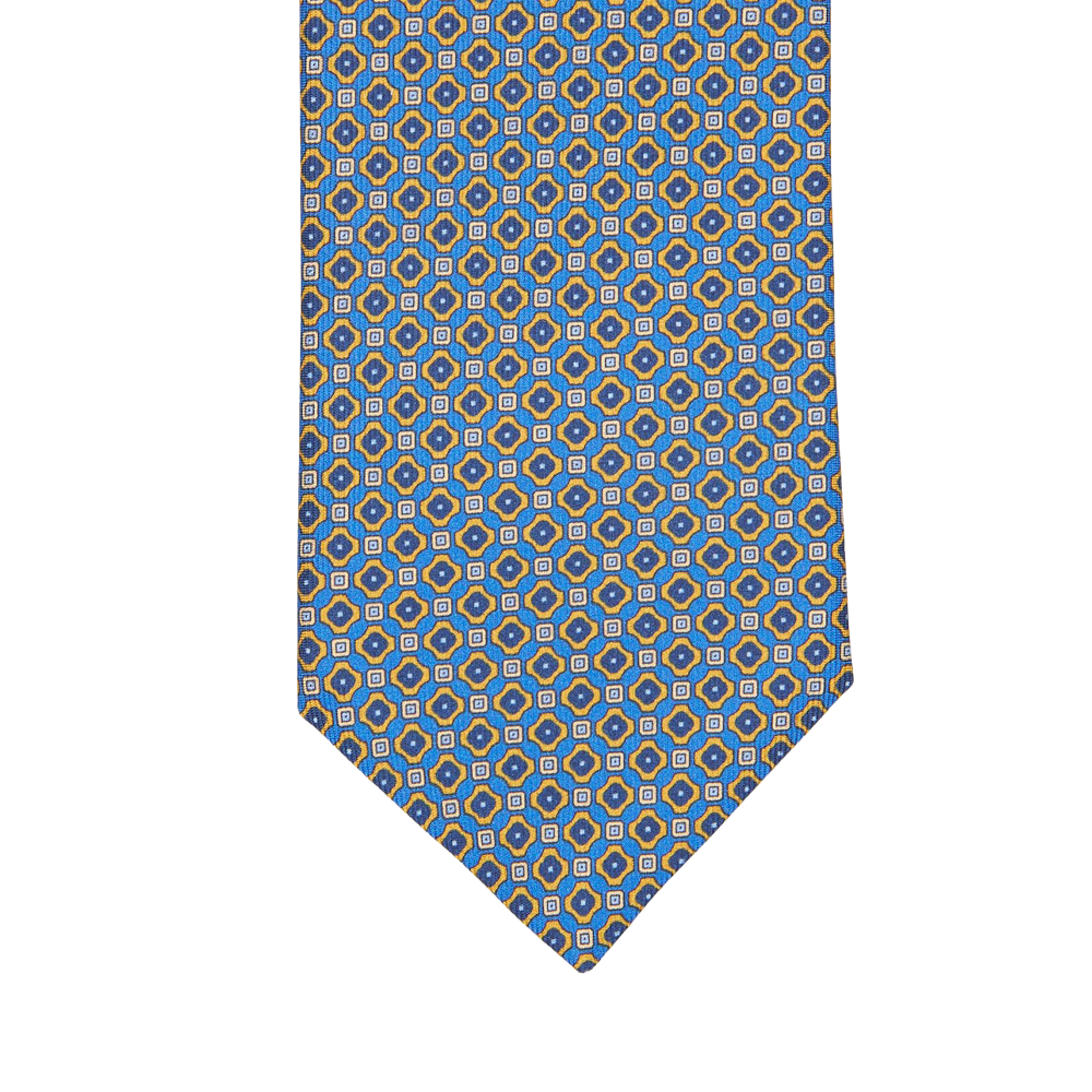 A Blue Geometrical Print 36oz Silk Twill Tie with circles, inspired by Italy and designed by Silvio Fiorello.