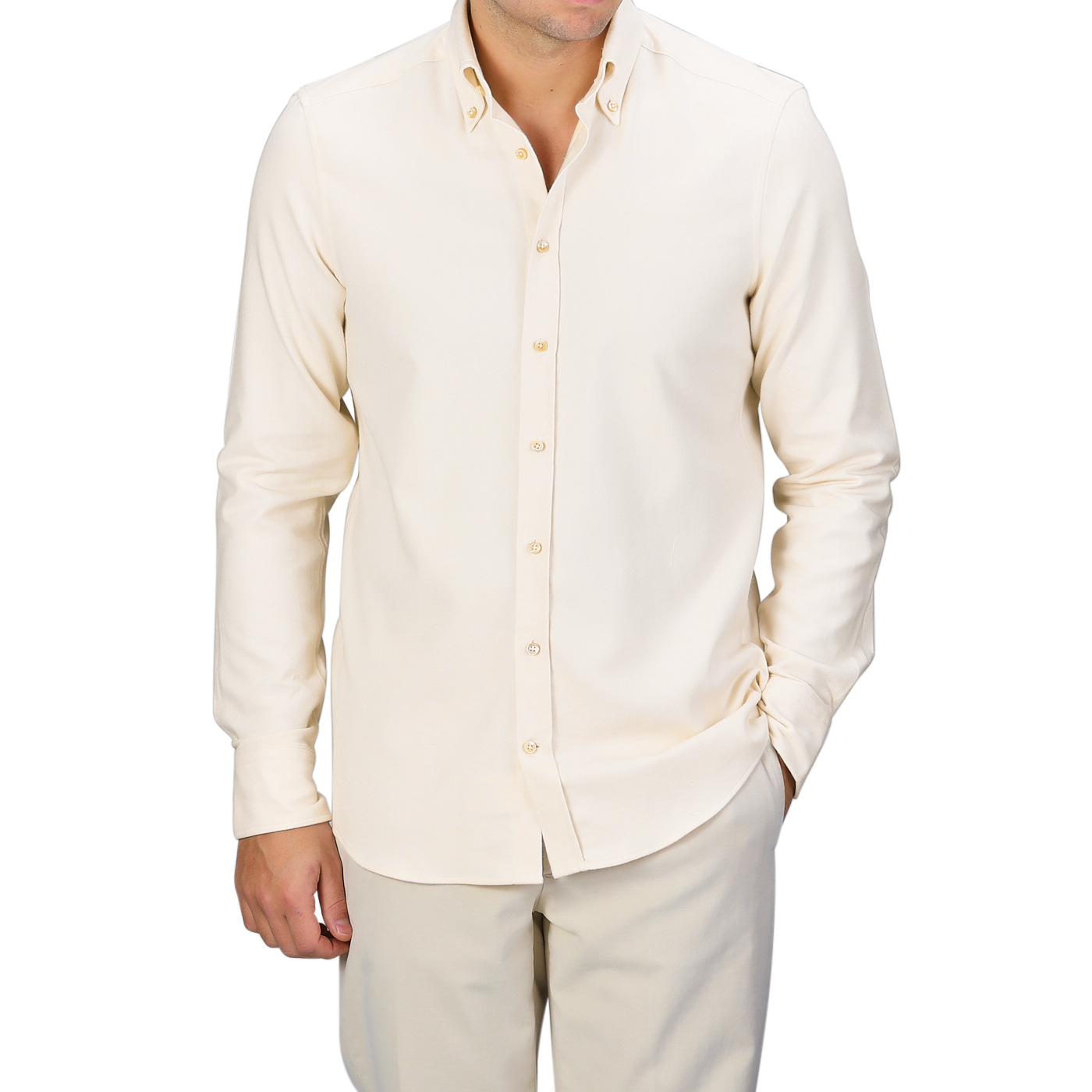A man wearing a Cream Cotton Flannel Slimline BD Shirt by Stenströms stands confidently with one hand in his pocket against a gray background.