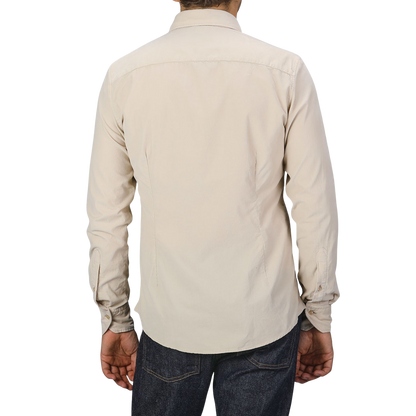A person wearing a Stenströms Light Beige Cotton Corduroy Slimline Shirt and dark jeans, seen from the back.