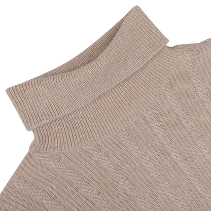 Close-up of the Taupe Beige Structured Merino Rollneck by Stenströms on a light gray background. The textured merino wool fabric is visible, highlighting a classic cable knit pattern ideal for any capsule collection.