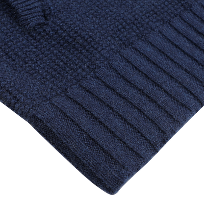 Close-up of a textured Royal Blue Cashmere Fur Collar Cardigan with ribbed cuffs from Stile Latino on a light surface.