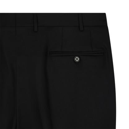 Close-up of the upper back of Canali Black Serge Wool Pleated Trouser, featuring a single welt pocket with black button, belt loops, and clean stitching. The smooth serge wool highlights its tailored, formal design. , available at Richard Gelding Mayfair