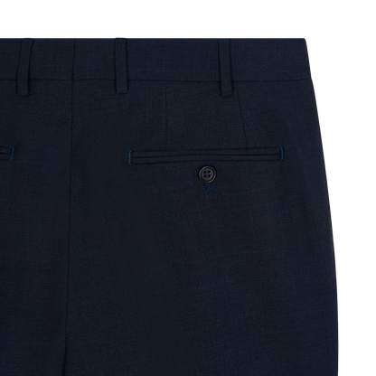 Close-up of Canali Blue Wool Stretch Flat Front Trousers shows the upper back with a single welt pocket, button closure, belt loops, and subtle textured fabric with visible stitching. , available at Richard Gelding Mayfair