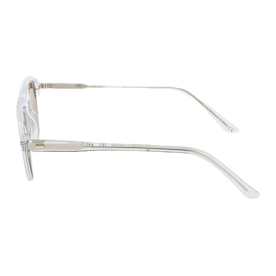 Transparent eyeglasses with metallic hinges and a vintage style acetate frame, isolated on a white background. (Product: The Bespoke Dudes Panama Transparent Tobacco Lenses 52mm)