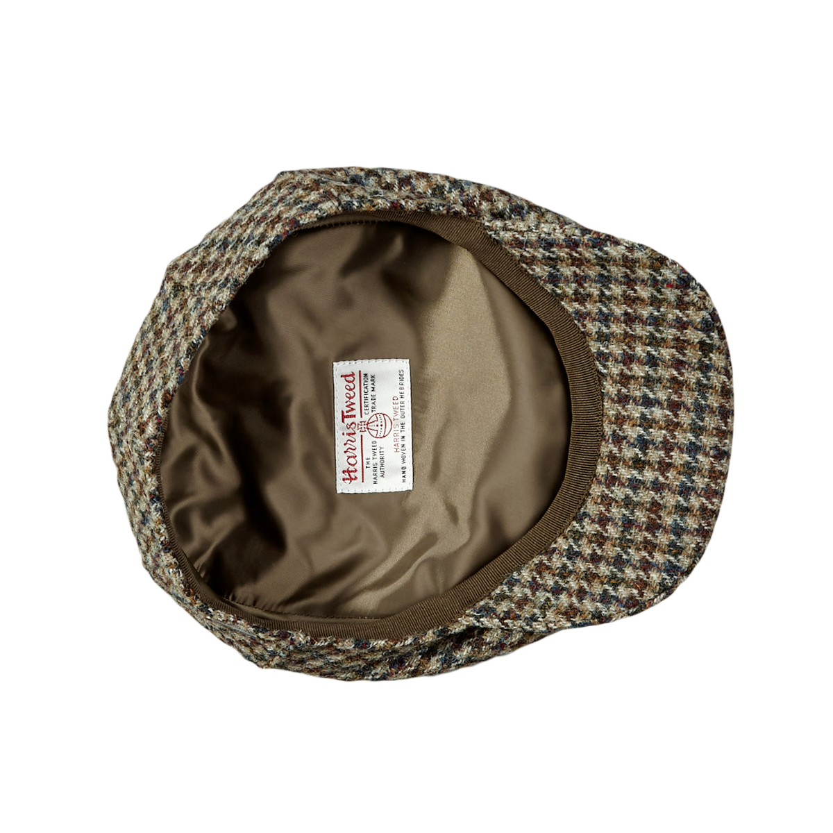 A beige Houndstooth Harris Tweed Ivy Contemporary Cap by Wigéns with a label on it.