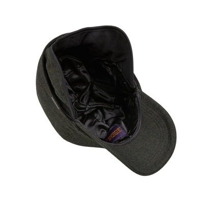 A hunter-green Wigéns tweed cap with a black lining made from Green Loro Piana Wool Cashmere.