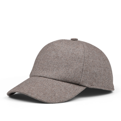 A high-quality Wigéns beige herringbone-patterned Angelico wool baseball cap with an adjustable strap, displayed against a white background.