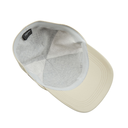 A Khaki Beige Nylon Microfibre Wigéns baseball cap on a white surface.