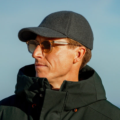 A man wearing a Green Loro Piana Wool Cashmere Baseball Cap by Wigéns.