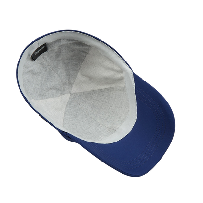 A Wigéns Mid Blue Microfibre Nylon Baseball Cap made of technical nylon microfibre on a white surface.