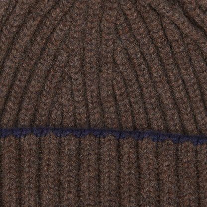 A Porcupine Blackberry Cashmere Ribbed Short Beanie with a blue stripe by William Lockie.