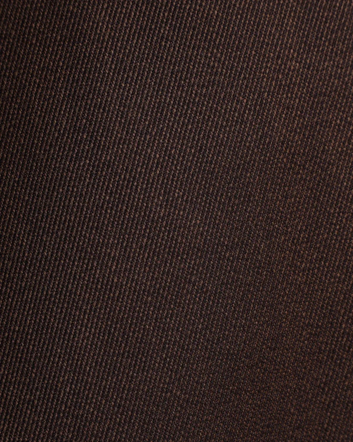 Close-up of dark brown Brown Straight Leg Pleated VBC Covert Wool Trousers by Cavour, featuring a distinct diagonal twill weave; the tightly woven Italian wool has a slightly textured, matte appearance. , available at Richard Gelding Mayfair