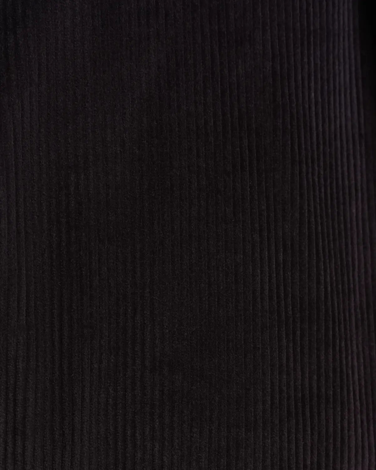 A close-up view of the dark navy corduroy fabric featured on these Cavour Navy Wide Leg Pleated Corduroy Trousers, showing uniform, vertical textured wales running in parallel lines across the frame. , available at Richard Gelding Mayfair