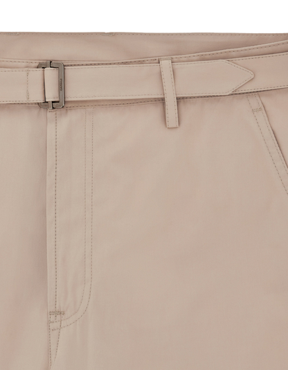 Close-up of Canali's Beige Cotton Poplin Self-Belt Trouser, featuring a smooth, breathable fabric, waistband with metal rectangular buckle, matching self-belt, belt loop, slanted pocket, visible fly, and neat topstitching. , available at Richard Gelding Mayfair