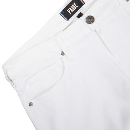 Close-up view of a white pair of Icecap White Cotton Transcend Federal Slim Jeans with a "Paige" brand label.