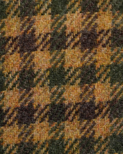 A close-up of a Cavour Brown Shepherds Check Tweed Blazer featuring thick, textured wool in a brown, olive green, and ochre yellow shepherds check pattern with a soft, fuzzy weave of visible fibers and diagonal lines throughout the crisscross design. , available at Richard Gelding Mayfair